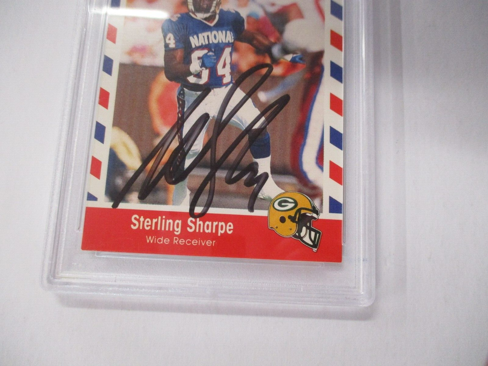 Sterling Sharpe NFL Autographed 1990 Stars N Stripes Topps Card #74 PSA Slab