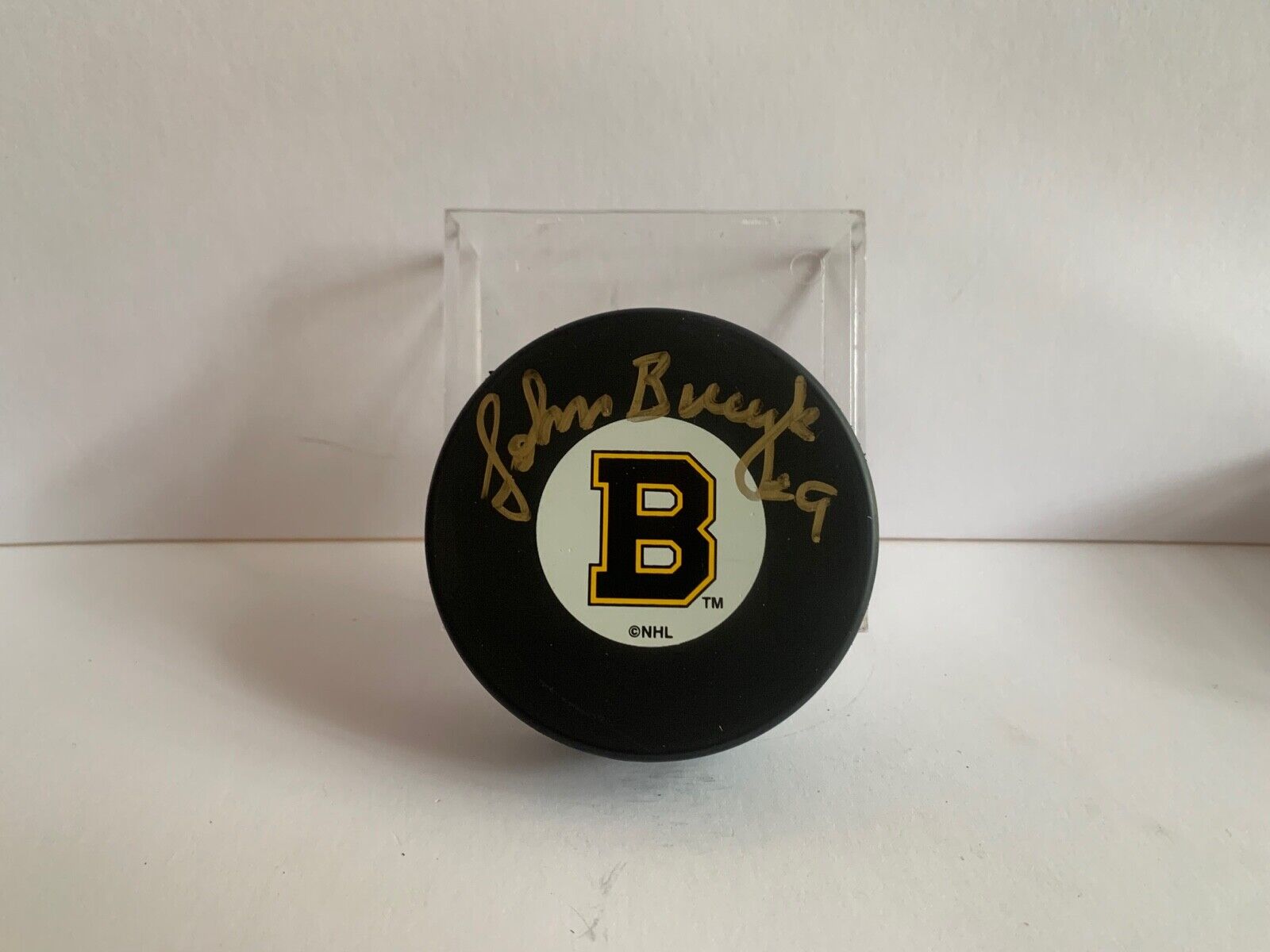 Johnny Bucyk Autographed Official NHL Hockey Puck with Boston Bruins Logo