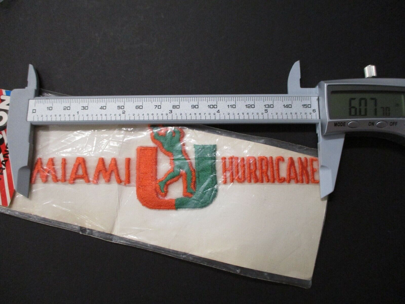 Miami Hurricanes UM Script Logo Patch 2 x 6 Inches Orange and Green with 'U'