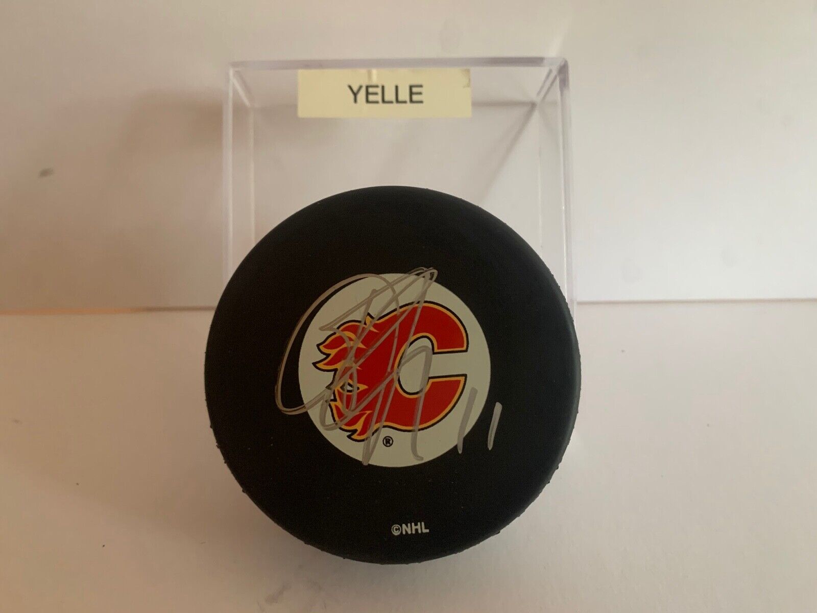 Stephane Yelle Autographed Official NHL Hockey Puck with Calgary Flames Logo